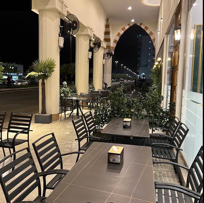 Outdoor terrace seating at Alishaan Restaurant in Madinah
